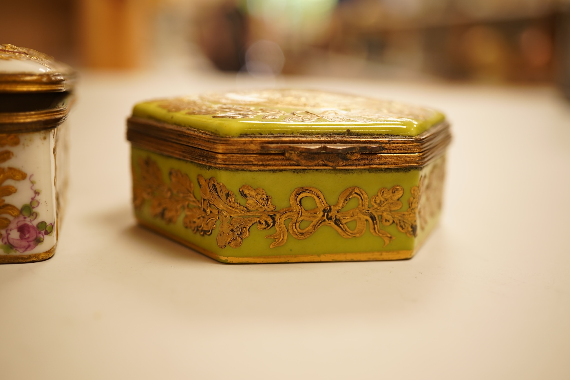 A Zsolnay lustre 'chicken' box and cover and two Sevres style porcelain boxes and covers (3) ‘chicken box’ 5cm diameter.